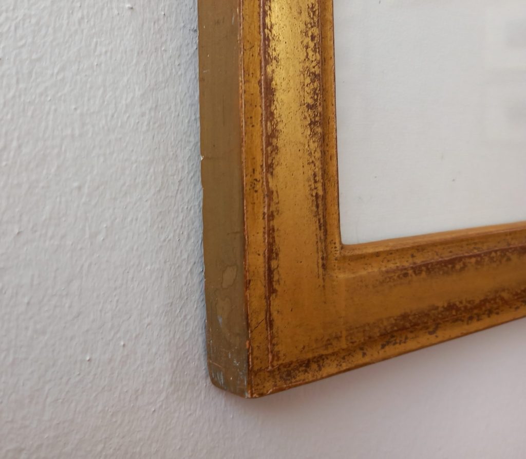 Détail de baguete dorée à la feuille d'or